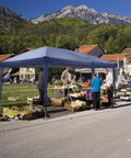 Ten By Twenty Foot Pop Up Canopy Tent With Six Sidewalls Blue Outdoor Gazebo For Patio Events Easy One Or Two Person Setup In Minutes Includes Carry Bag Premium Commercial Grade Party Shelter in a market setting.