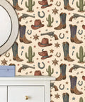 Vintage Wild West Peel and Stick Wallpaper Self Adhesive for Rustic Barn Decor featuring cowboy hats, boots, guns, and cacti.