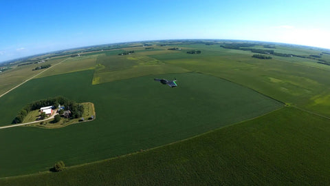 Double 4K Fixed Wing Drone With 1 Hour Flight Time And 35 MPH Cruise Long Range Omnidirectional Link Over 2 Miles flying over fields