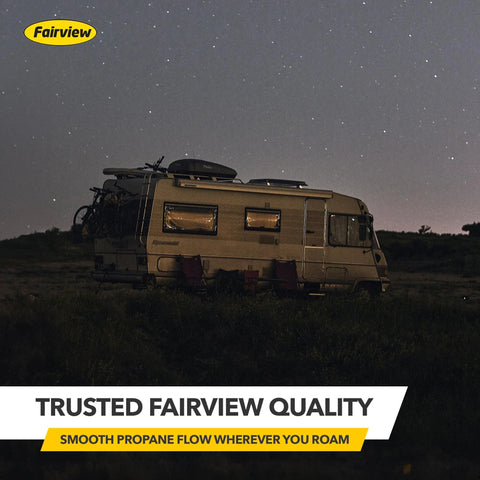Fairview RV camper side view on grass at night with bikes on rear rack under a starry sky