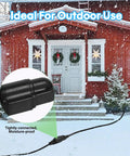 Outdoor Power Extension Cord 30 Ft 16 AWG 3 Prong Grounded Heavy Duty Weatherproof Cable used with Christmas lights in snowy yard.