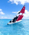 53 Inch Remote Control Sailboat Kit With Pre Assembled Sail Accessories sailing on clear blue water, red and black sail