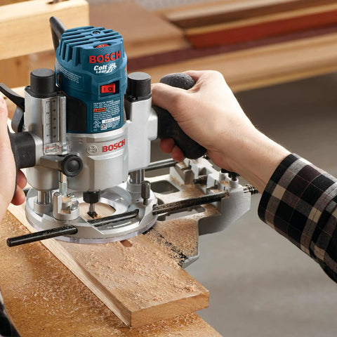 Person using Bosch router for precise grooving with Six Piece Universal Groove Cutter Router Bit Set With Carbide Tips