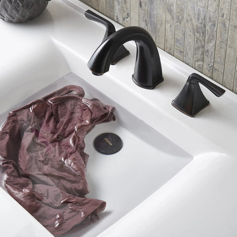 Selia 8 Inch Widespread Bathroom Sink Faucet Two Handle 3 Hole Deck Mount In Tuscan Bronze Finish with water filling the basin