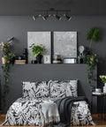 Bedroom with Dope Lofty Industrial Four Light Track Lighting Fixture with Pivoting Heads in Matte Black and Brass Accents over bed.