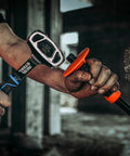 Person using Drilling And Crack Hammer 3 Lb Small Sledge One Piece Forged Steel Construction Tool on concrete, close-up view.