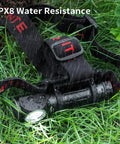 Long Throw Headlamp With 323 Meter Beam For Long Range Vision And 1755 Lumen Rechargeable LED, IPX8 water resistance in grass.