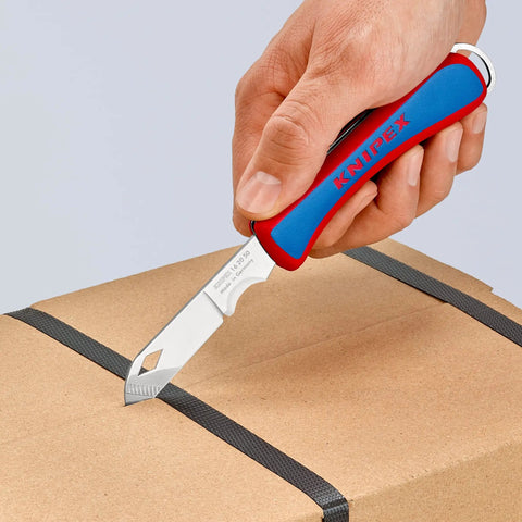 Person using Everyday Carry Folding Knife With Ultra Sharp Solingen Blade, Tough Ergonomic Handle, on cardboard box