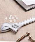 Anchor-Shape LED Strip Clips White Plastic Mounting Brackets for LED Light Strips on table with wrench and bolts
