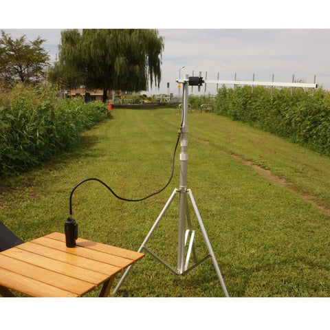 Elele 9-Element Yagi Antenna For Amateur Radios, 1260-1300 MHz Band, mounted on a tripod with coax cable outdoors