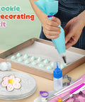 Badass 112 Piece Baking Decorating Kit With Sturdy Acrylic Turntable, Flexible Silicone Piping Bags in use with frosting on tray.