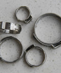 Heavy Duty Pex Pinch Clamps Kit With Five Sizes Three Eighths Inch One Half Inch Five Eighths Inch Three Quarters Inch And One Inch 50 Pieces Cinch Clamps For Securing Pipes And Hoses In Plumbing shown on a surface