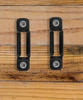 Heavy Duty Black Furniture Connectors And Hidden Screws For Dressers Bookshelves 50 Set Anti Rust Hardware on wood background.