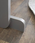 Close-up of the base of the 12 Bin Toy Storage Organizer For Kids Playroom, 4-Tier Toy Organizer in Grey and White on wood floor.