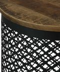 Premium Drum Base Accent Table Featuring A Perforated Quatrefoil Metal Lattice And Rich Mango Wood Top close-up of black metal lattice and wood grain surface.