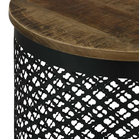 Premium Drum Base Accent Table Featuring A Perforated Quatrefoil Metal Lattice And Rich Mango Wood Top close-up of black metal lattice and wood grain surface.