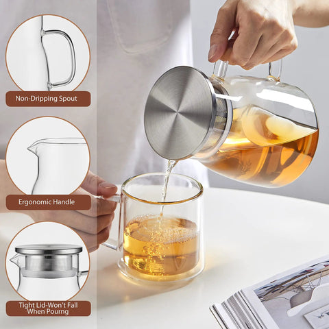 Person pouring tea from One Touch Glass Teapot 27 Oz 800 Ml Glass Tea Kettle With Stainless Steel Filter Lid into glass cup