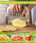 Suuker extra-large crinkle cutter with wooden handle; stainless steel wavy potato slicer in use on potato.