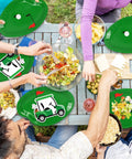 Dope 90 Piece Golf Party Paper Plates And Disposable Napkin Set Featuring Fresh Green Golf Course Layouts With Cool Sports Ball Print Tableware at picnic table with food.