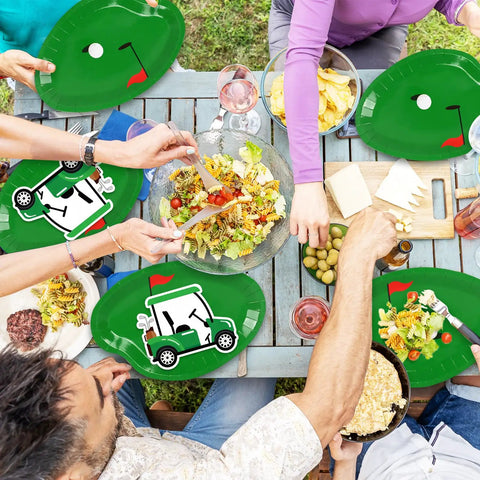 Dope 90 Piece Golf Party Paper Plates And Disposable Napkin Set Featuring Fresh Green Golf Course Layouts With Cool Sports Ball Print Tableware at picnic table with food.