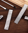 12 Pcs Flange Wedge Set In Stainless Steel One Half By Three Quarters By Four Inches Beveled Right Angle Wedges on wooden surface with tools
