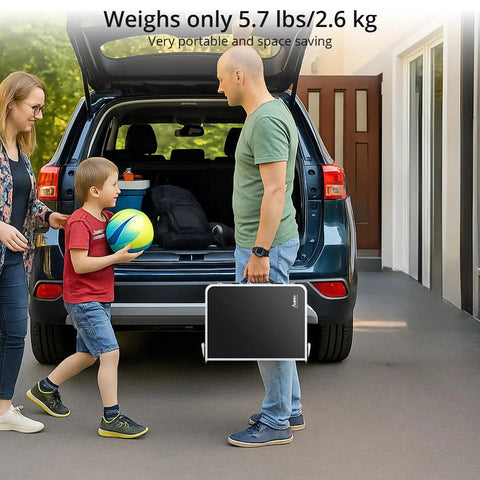 Man holding Folding Camping Table With Aluminum Build 24 Inch By 16 Inch Portable Table Lightweight for picnic shown by car