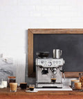 Barista Express Inspired Espresso Machine With Built In Grinder For Quick Beans To Espresso Dose Control Grinding 4 Keys Formula Home Barista Setup In Brushed Stainless Steel on kitchen counter with beverages and cups.