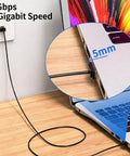 Close-up of laptop connected to wall using 2-Pack Cat6 Ethernet Cables, Ultra Slim Flat Patch Cord, 15cm Short Length, 5mm connectors.
