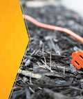 Bright Orange 50ft Outdoor Extension Cord 16/2 Two-Prong With SJTW Jacket For Landscaping Or Light-Duty Power, Weatherproof Molded Plug Durable Outdoor Use For Lawn Care Garden Tools Leaf Blowers And More lying on bark mulch with two-pronged plug visible