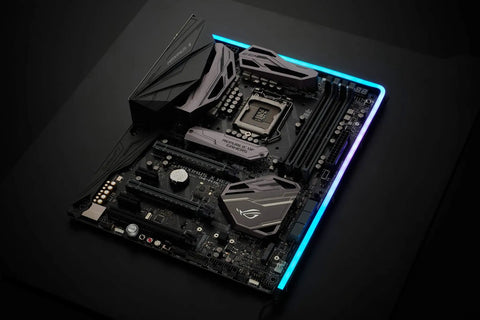 Neon Digital RGB LED Strip M1 1 Meter Flexible Mounting Full Color Range illuminating a black gaming motherboard top view