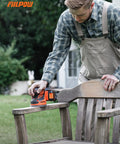 Man using Cordless Random Orbital Sander 20V Brushless With 2.0Ah Battery Micro-Filter Cyclonic Dust Box on outdoor wooden chair