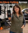 Woman using Hassle Free Wireless RV Leveling System With Bluetooth App Control outside travel trailer, showcasing smartphone app.