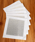 Pack of six Self Adhesive Drywall Patch 4x4 Inch Aluminum Mesh Patch Kit on wooden surface