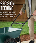 Heavy Duty Dual Wheel Wheelbarrow Garden Cart With 500 Pound Capacity being pushed on lawn for yard work