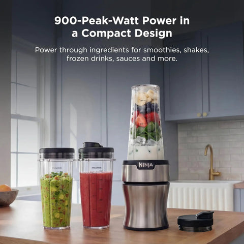 Heavy Duty Personal Blender Featuring 900W Push To Blend Motor And Pro Extractor Blades Crushing Ice For Nutrient Dense Smoothies Including Three Grab And Go 20 Oz Serveware Cups In Classic Silver with smoothie ingredients and cups.