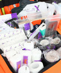 Lightning X Value Compact Medic First Responder trauma bag, orange, opened to reveal basic fill kit and assorted first-aid supplies