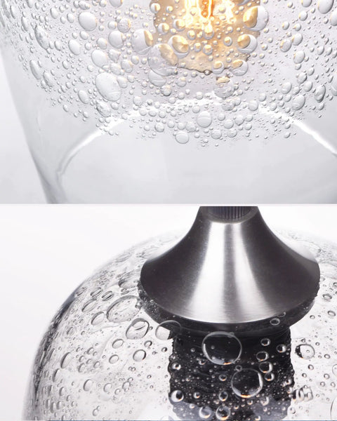 Close-up of Three Light Teardrop Glass Pendant Chandelier With Hand Blown Seeded Bubbles, showcasing textured glass detail.