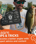 Angler holding Pro Bass Fishing Kit and largemouth bass against a lake backdrop