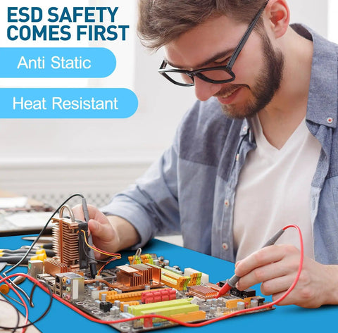 Man using Anti Static Mat Kit With Heat Resistant ESD Mats Pro Grade Wrist Strap Grounding Cord And Soldering Table Pad