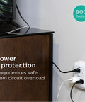 Six-Outlet Surge Protector Wall Tap, 2 Pack, 900 Joules in use on wall with devices plugged in, ideal for home office.