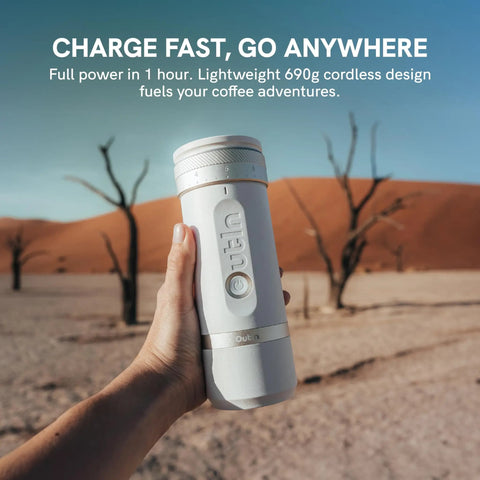 Person holding Fino Portable Electric Coffee Grinder with 28 Grind Settings in desert setting