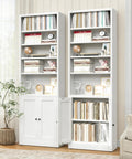 Slick 7 Tier Metal Bookcase 71 Inch White With Doors Industrial Display Shelf Unit in living room with books and decor.