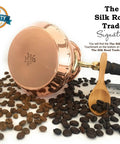 Dope Thick Solid Copper Turkish Greek Arabic Coffee Pot With Wooden Handle surrounded by coffee beans and a wooden scoop