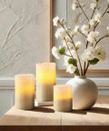 LED Flameless Candles Set With Remote Control And Timer 3 Pack Battery Operated With 2 4 6 And 8 Hour Timers Handcrafted Beads And Glitter Luxury Silver Finish arranged on table with vase