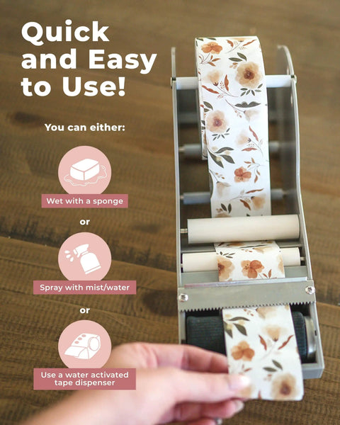 Premium Water Activated Packing Tape Straight Up For Sealing Corrugated Boxes And Gift Cartons With Rosy Floral Print Biodegradable Gummed Paper Shipping Rolls For Ecommerce Hustlers in a dispenser, ready for use.