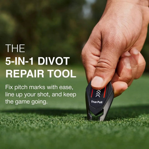 Person using 5 In 1 Divot Repair Tool With Ball Marker Alignment Aid For Golfers Fix Pitch Marks Rest Your Club Clean Grooves And Mark Your Spot On The Green All In One Black Golf Accessory For Men And Women On The Course on green grass