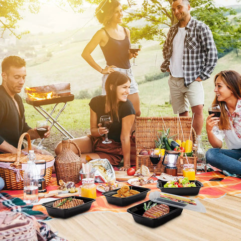 Group enjoying picnic with 50 Pack 32oz Meal Prep Containers With Leakproof Lids BPA-Free Plastic Food Storage on blanket.