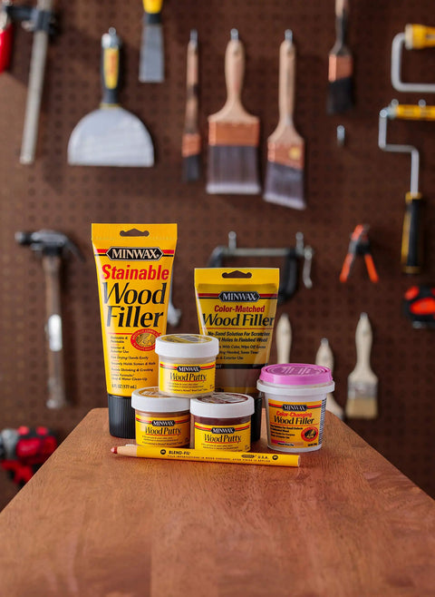 Minwax Golden Oak Wood Putty Filler For Quick Scratch And Nail Hole Repair Non Hardening Stain Matched Diy Wood Touch Up 3.75 Oz Tub products displayed on a workbench.