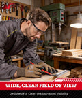 Man wearing Anti-Fog Safety Glasses With Scratch-Resistant Wraparound Lenses in workshop, ANSI Z87.1 Plus Impact Rated.