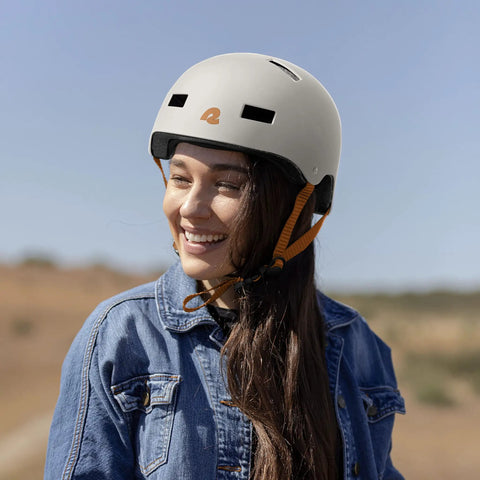 Woman wearing Dakota Adult Bike And Skate Helmet For Daily Commutes And All Action Sports, Matte Eggshell Finish, Impact Resistant